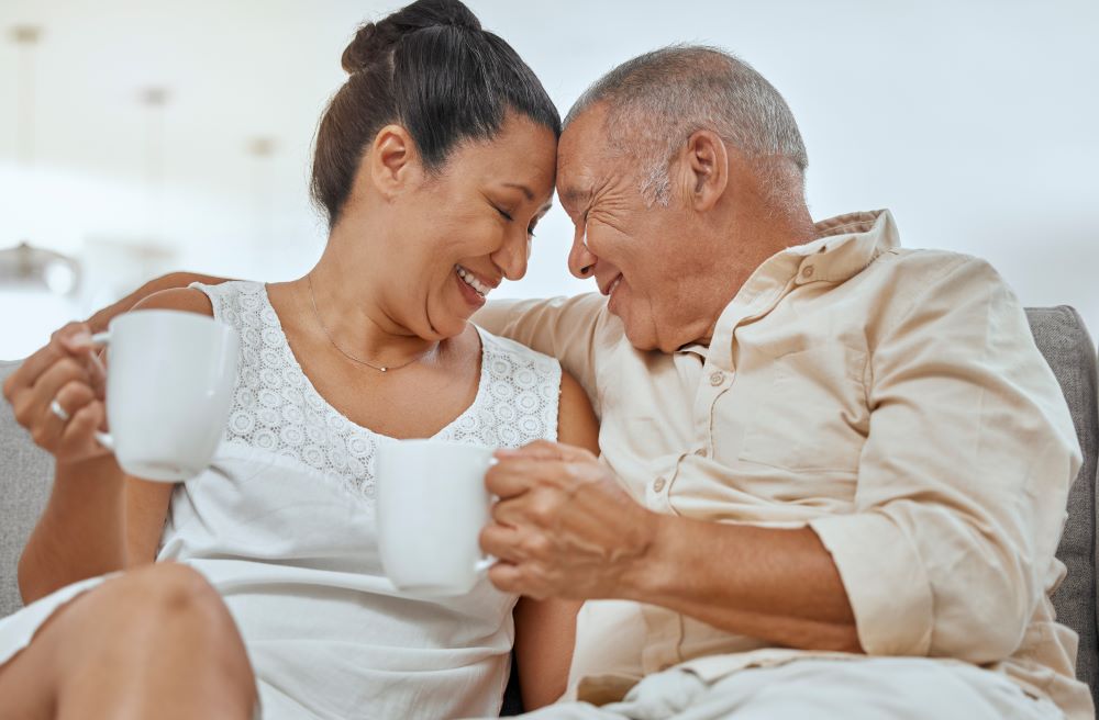 Couple having a tea on a couch